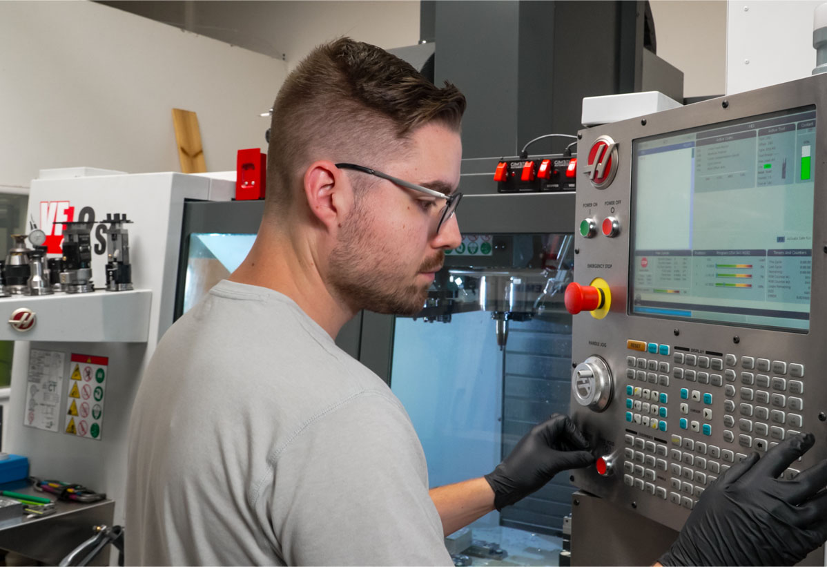 Ben at Toolpath operating a Haas CNC Mill